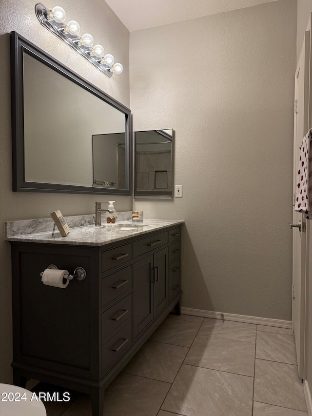 bathroom featuring tile patterned floors and vanity