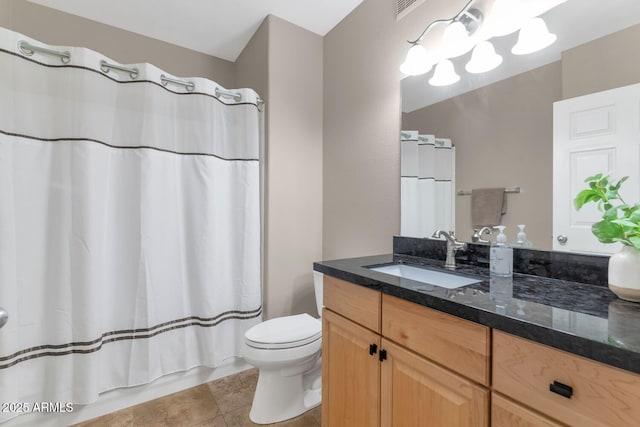 full bathroom with vanity, toilet, and shower / tub combo with curtain