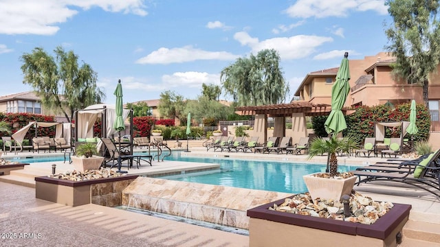 view of swimming pool featuring a pergola and a patio