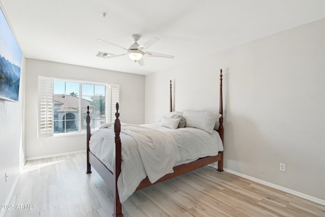 bedroom with ceiling fan and light wood-type flooring