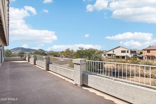 exterior space featuring a mountain view and fence