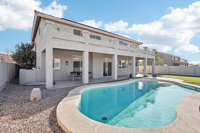 view of swimming pool with a patio area