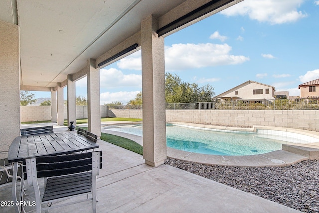 view of swimming pool with a patio