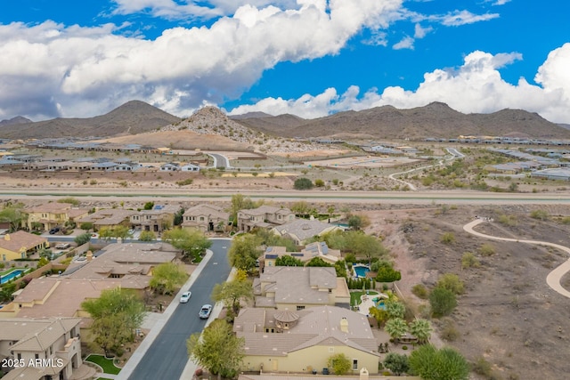 birds eye view of property featuring a mountain view