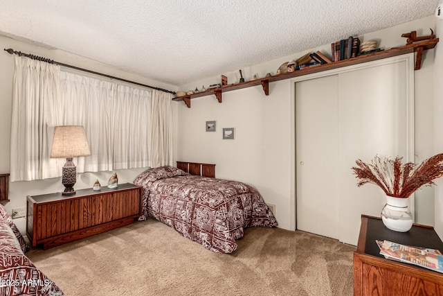 1108 N Oro Vis, Litchfield Park, AZ 85340 - carpeted bedroom with a closet and a textured ceiling