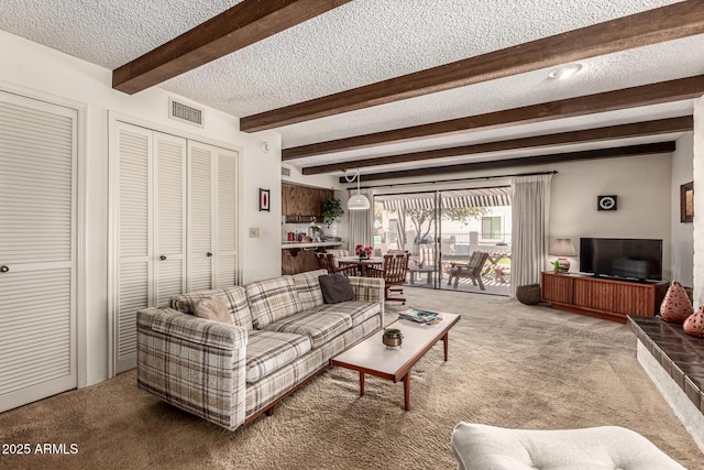 1108 N Oro Vis, Litchfield Park, AZ 85340 - living room with a textured ceiling, carpet floors, and beam ceiling