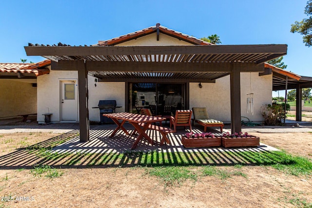 1108 N Oro Vis, Litchfield Park, AZ 85340 - rear view of house featuring stucco siding, a patio, a pergola, and a tile roof