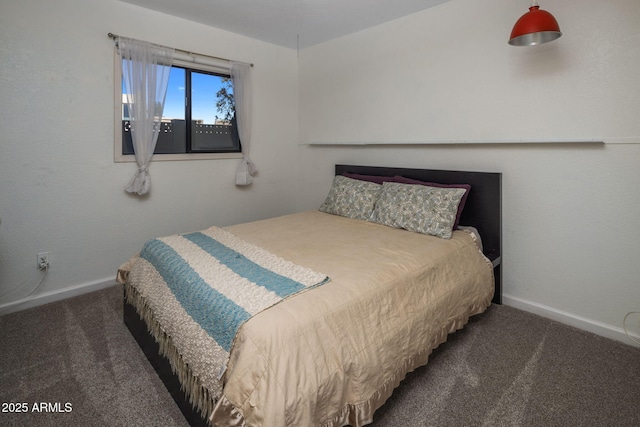 bedroom featuring dark colored carpet