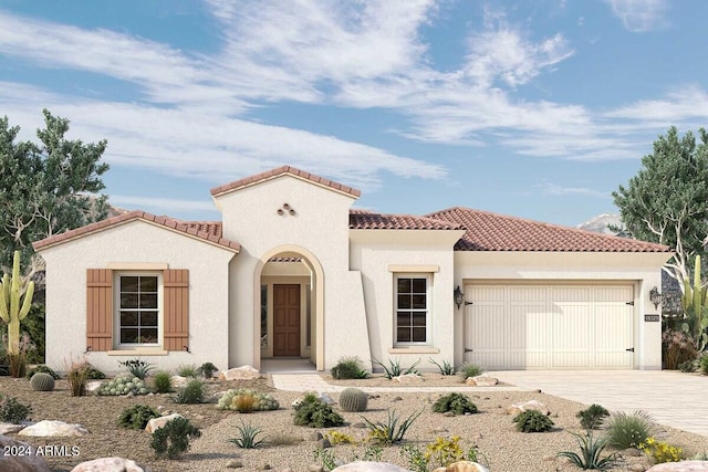 mediterranean / spanish-style house featuring an attached garage, driveway, a tiled roof, and stucco siding