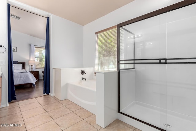 ensuite bathroom with tile patterned flooring, ensuite bathroom, an enclosed shower, visible vents, and a bath