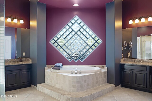 8540 E Mcdowell Rd Unit 10, Mesa, AZ 85207 - bathroom with two vanities, a garden tub, and tile patterned flooring