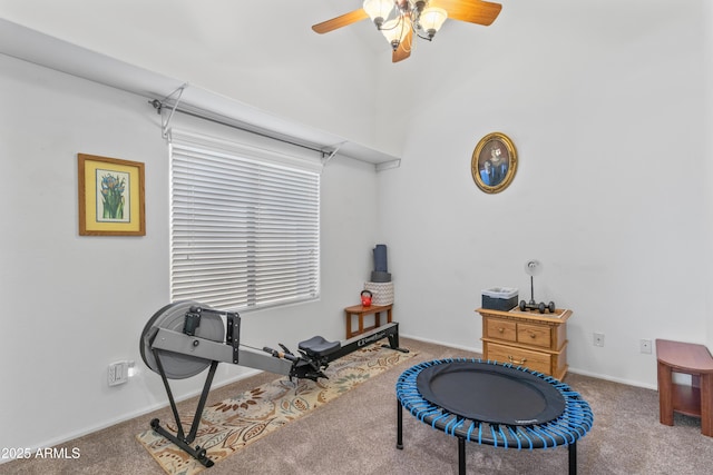 exercise area featuring ceiling fan and carpet flooring