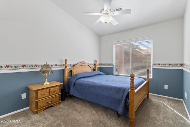 carpeted bedroom with vaulted ceiling, visible vents, baseboards, and ceiling fan