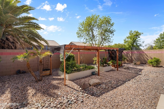 view of yard featuring a vegetable garden and a fenced backyard