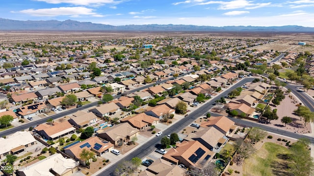 drone / aerial view featuring a residential view and a mountain view