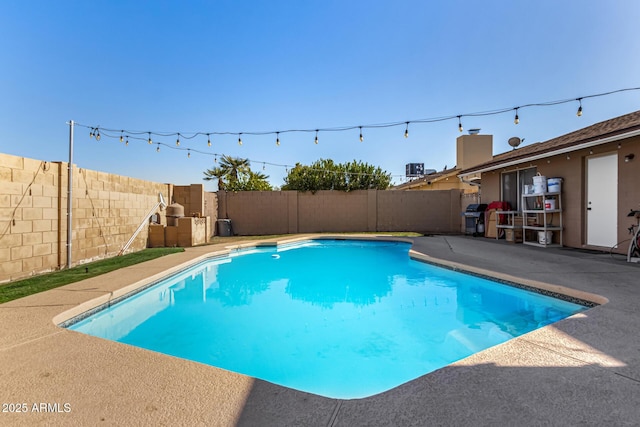 view of swimming pool featuring grilling area