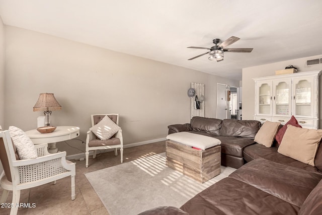 living room featuring ceiling fan and light tile patterned floors