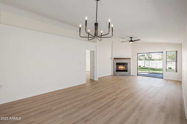 14239 N Edgeworth Dr Unit A, Fountain Hills, AZ 85268 - unfurnished living room with light wood-style flooring, a ceiling fan, a chandelier, and baseboards