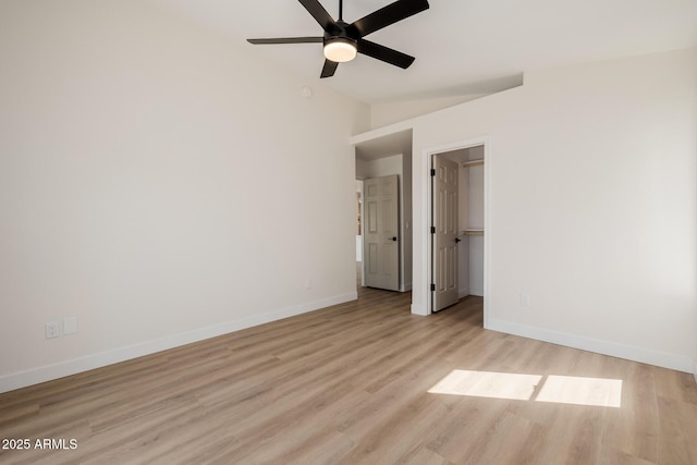 14239 N Edgeworth Dr Unit A, Fountain Hills, AZ 85268 - unfurnished bedroom with light wood-style floors, baseboards, lofted ceiling, a spacious closet, and a ceiling fan