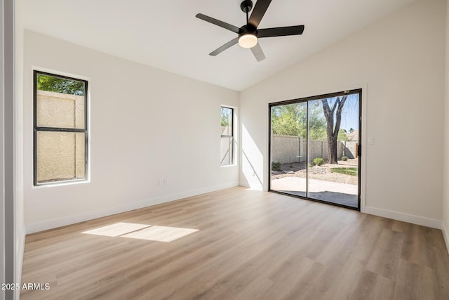 14239 N Edgeworth Dr Unit A, Fountain Hills, AZ 85268 - empty room featuring light wood-style floors, ceiling fan, baseboards, and vaulted ceiling