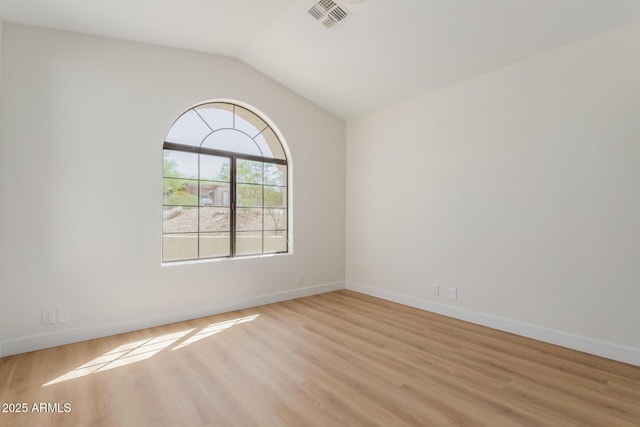 14239 N Edgeworth Dr Unit A, Fountain Hills, AZ 85268 - unfurnished room featuring light wood-style flooring, lofted ceiling, and baseboards