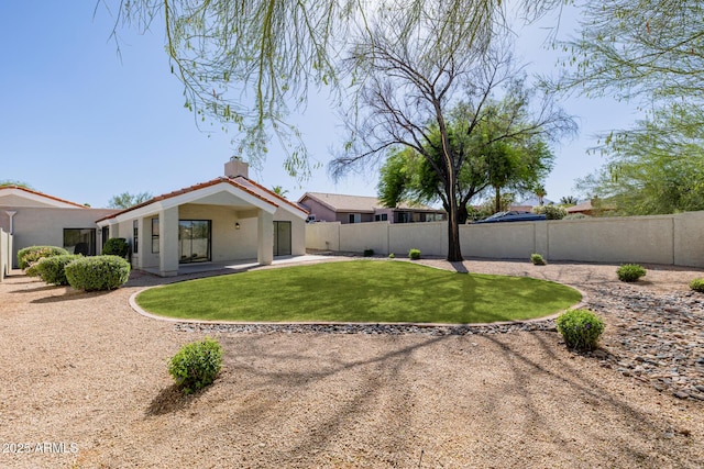 14239 N Edgeworth Dr Unit A, Fountain Hills, AZ 85268 - back of house featuring stucco siding, a patio, and a chimney