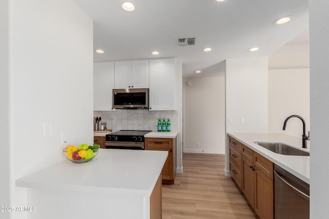 14239 N Edgeworth Dr Unit A, Fountain Hills, AZ 85268 - kitchen featuring a sink, stainless steel appliances, light wood-type flooring, light countertops, and recessed lighting