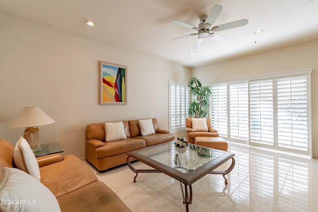 living room with light tile patterned floors and ceiling fan