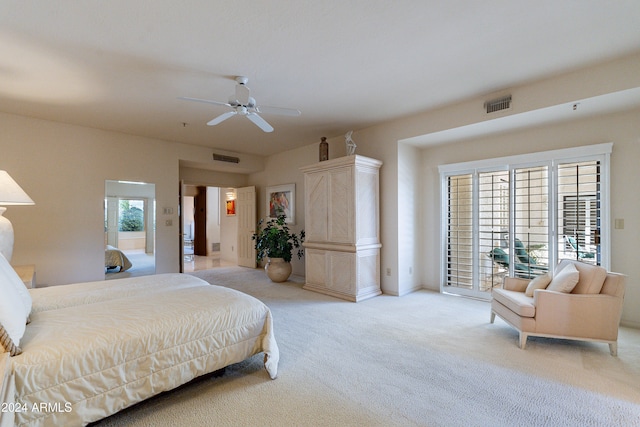 carpeted bedroom with ceiling fan, access to exterior, and multiple windows