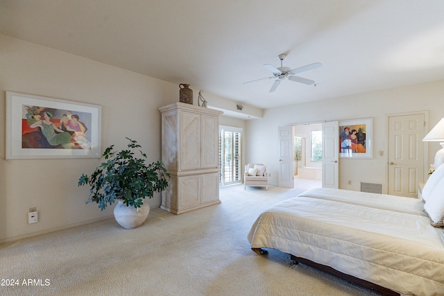 carpeted bedroom with connected bathroom and ceiling fan