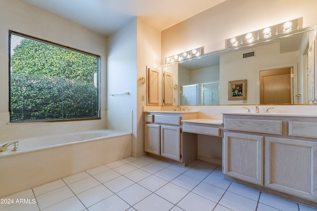 bathroom featuring tile patterned floors, plus walk in shower, and vanity