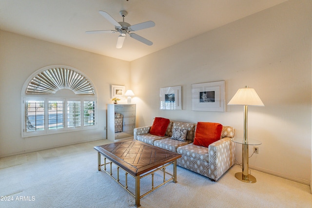 living room with light colored carpet and ceiling fan