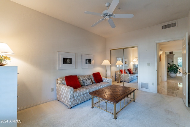 living room featuring carpet flooring, ceiling fan, and lofted ceiling