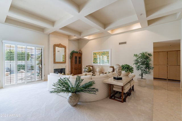 tiled living room featuring beam ceiling, a fireplace, and coffered ceiling