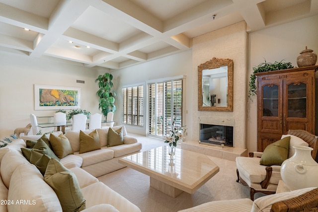 living room with a fireplace, beamed ceiling, and coffered ceiling