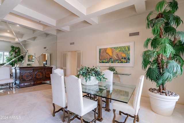 carpeted dining area with beam ceiling and coffered ceiling