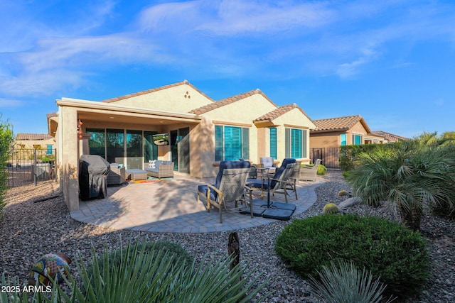 rear view of property with a patio area