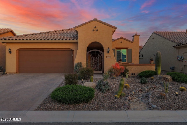 mediterranean / spanish-style home featuring a garage