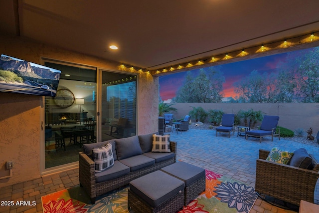 patio terrace at dusk with outdoor lounge area