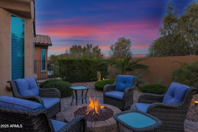 patio terrace at dusk with a fire pit