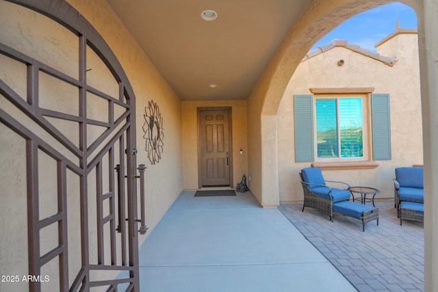 doorway to property with a patio area