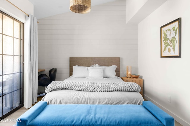 bedroom with lofted ceiling