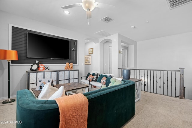 living room featuring ceiling fan and light colored carpet