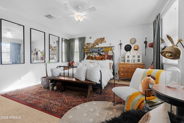 carpeted bedroom featuring ceiling fan