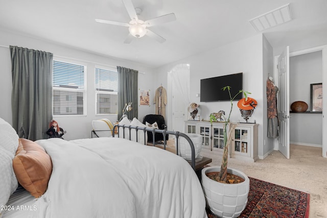 carpeted bedroom featuring ceiling fan