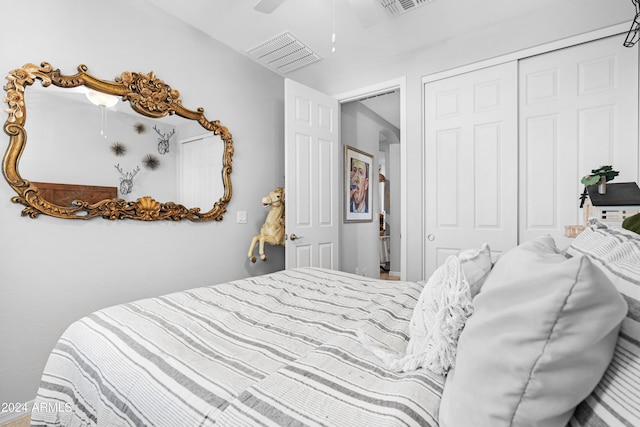 bedroom featuring ceiling fan and a closet