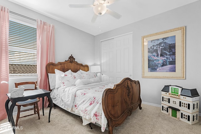 carpeted bedroom with a closet and ceiling fan