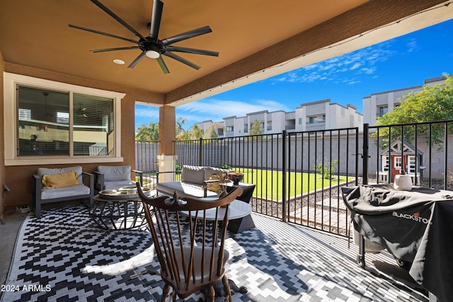 view of patio featuring ceiling fan and an outdoor living space