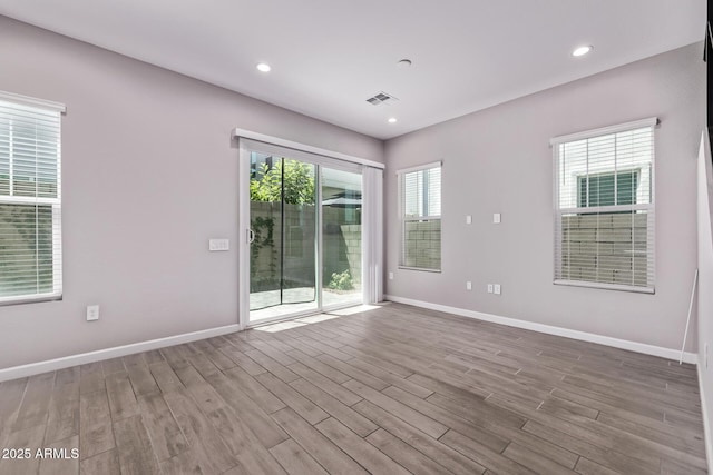 17118 N 50th Way, Scottsdale, AZ 85254 - unfurnished room featuring wood finished floors and recessed lighting