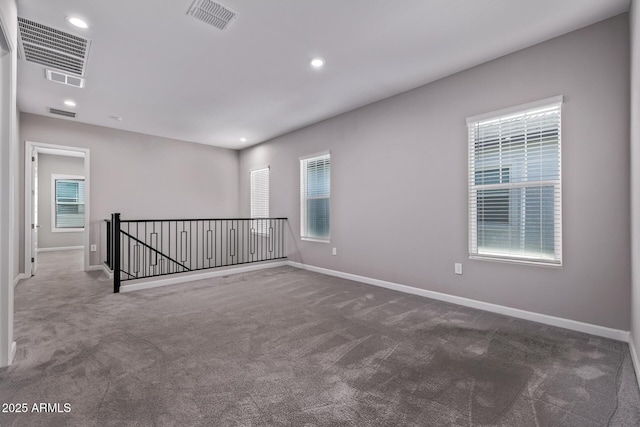 17118 N 50th Way, Scottsdale, AZ 85254 - spare room featuring dark colored carpet, plenty of natural light, and recessed lighting